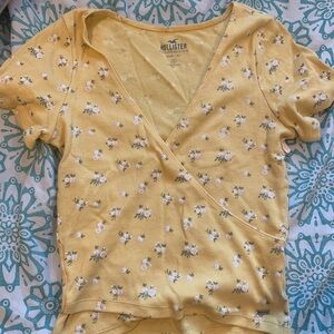 yellow cross over tee